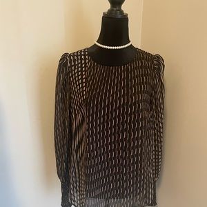 Brown and tan printed sheer black blouse